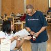 Georgia S.P.E.A.K.S Inc. Sakina Coakley lends a healing hand to assist one of the seniors during our Diabetes Alert Day presentation at H.J.C. Bowden Senior Multipurpose Facility in East Point.