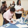 Georgia S.P.E.A.K.S Inc. Sakina Coakley lending her healing hands to assist our seniors during our Diabetes Alert Day presentation at H.J.C. Bowden Senior Multipurpose Facility in East Point. 